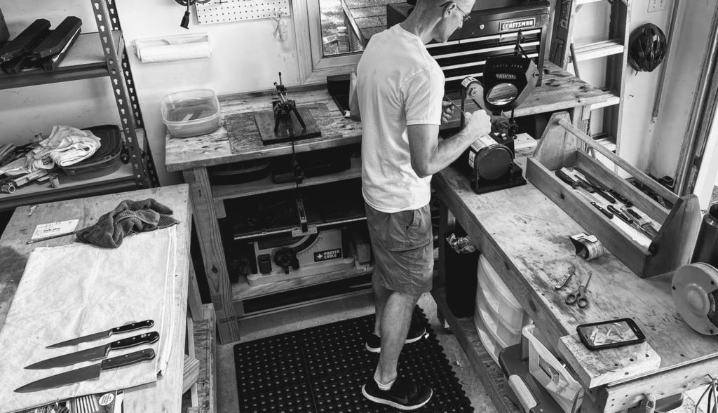John Garland, owner and sharpener in the shop at norfolk sharpening, a professional knife and tool sharpening service.