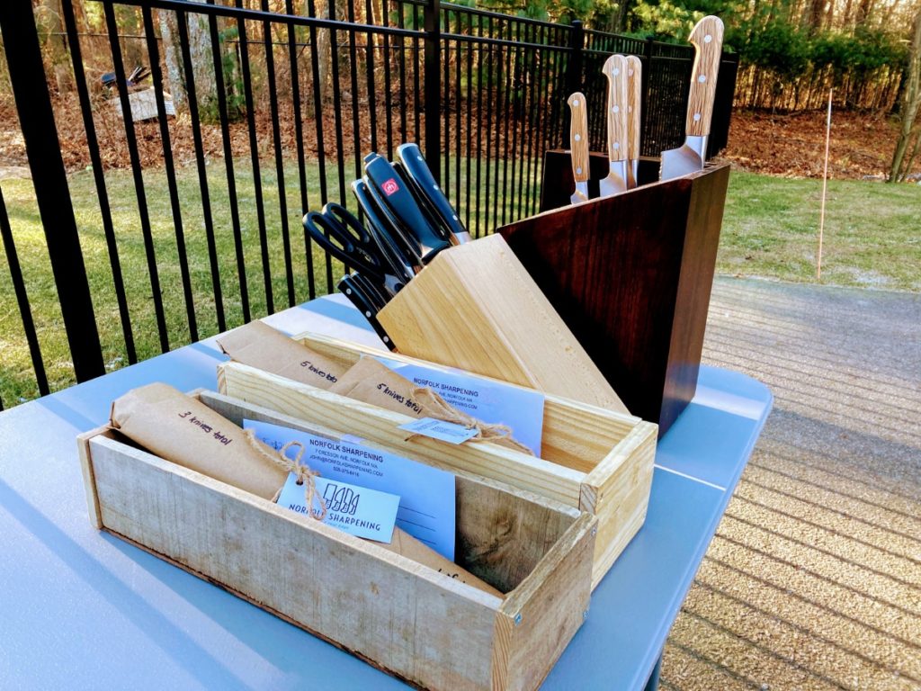 newly sharpened knives ready for pickup at a mobile sharpening event