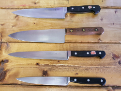 four sharpened kitchen knives